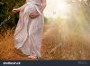 stock-photo-stomach-of-the-pregnant-woman-in-a-summer-dress-on-the-road-outdoors-404355616.jpg