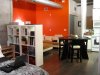 RMS_rbaby-studio-apartment-red-focal-wall-exposed-beams_s4x3.jpg.rend.hgtvcom.1280.960.jpeg