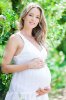 22354338-Pregnant-woman-posing-in-a-green-apple-garden-Stock-Photo-pregnant.jpg